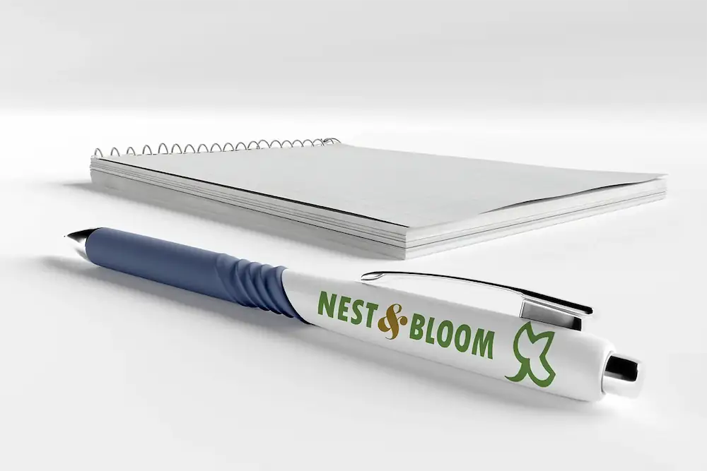 Promotional merchandise design showing Nest and Bloom brand on stationery