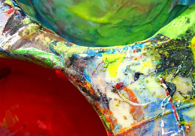 Macro photography of vibrant artist palette textures and paint mixing