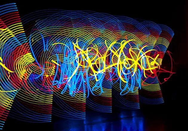 Long exposure light writing photography in a vibrant graffiti art style