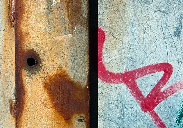 Tactile photography study of rust textures and weathered metal scribbles